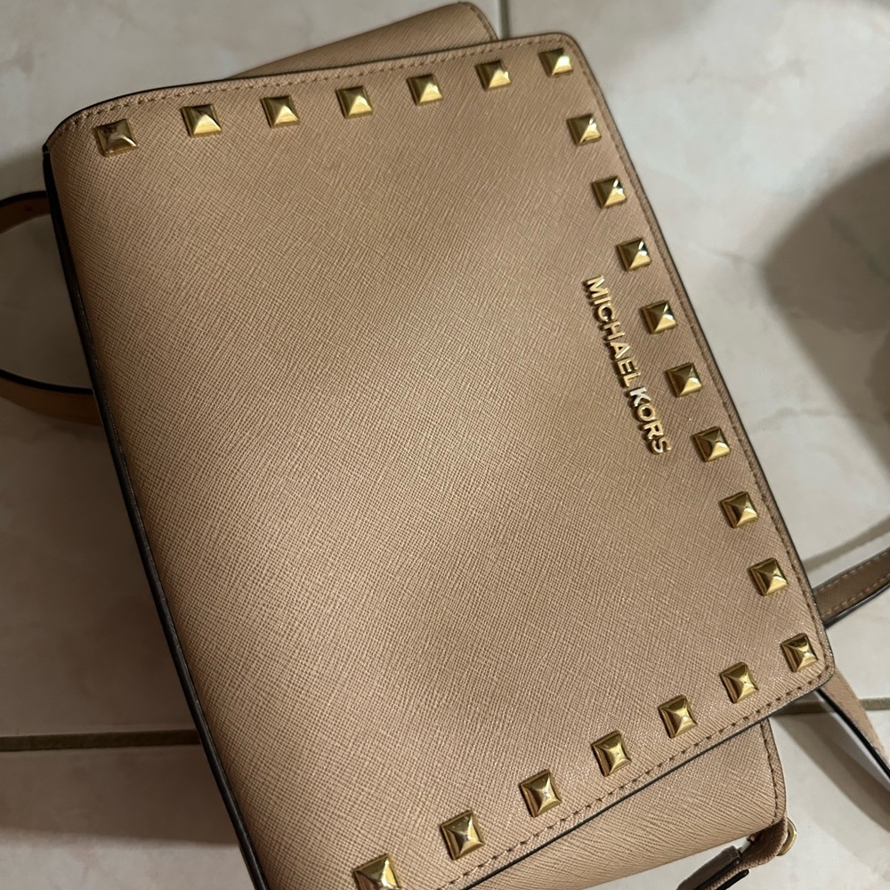 Michael Kors light pink cross body bag.